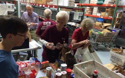 TIAA volunteers sorted food at Network of Community Ministries in May, 2015.