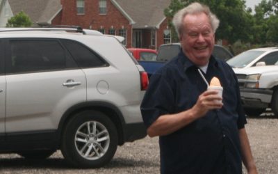Jon Campbell looks happy with his peach ice cream at Ham Orchard in July.