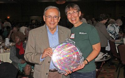 Linda Smittle presents the winner of the Jack Kilby-signed wafer raffle to Carlos Vakdivia at the 2015 TI retiree luncheon.
