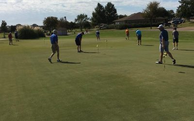Golfers practiced on the beautiful putting green before the October 24 Charity Golf Tournament