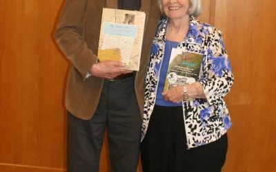 Ed Millis holds his latest book while Shirley Sloat displays a book she just finished editing at the TIAA annual meeting May 25, 2017.