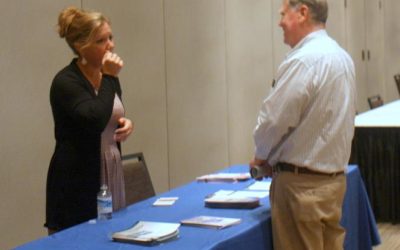 Bill Sterns talked to a OneExchange rep at the Post-65 Health Benefits Seminar on October 26, 2017.